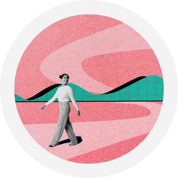 person walking along a path through mountains