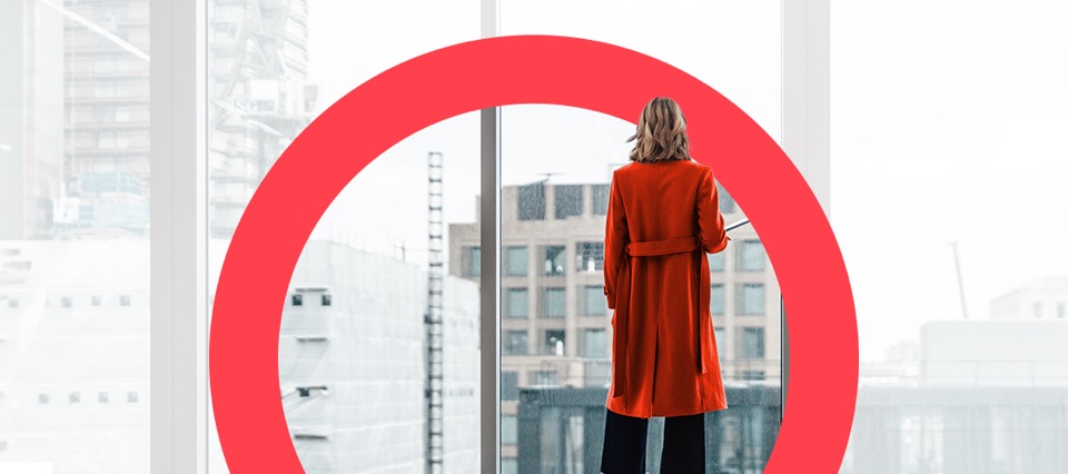 A woman looking out on a cityscape