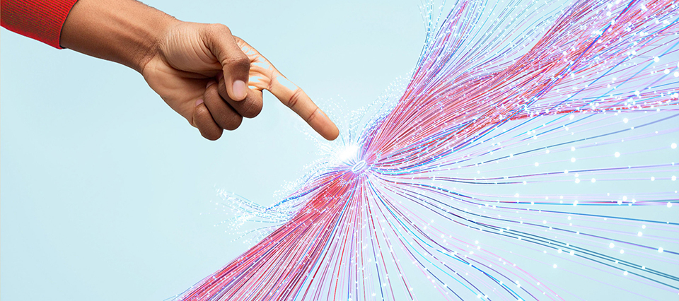 person’s finger pointing at a spot igniting streams of data and intelligence all around it