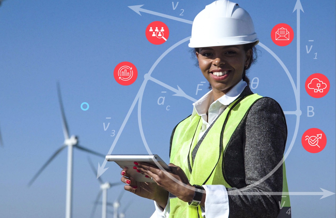 An engineer woman smiling and holding a tablet