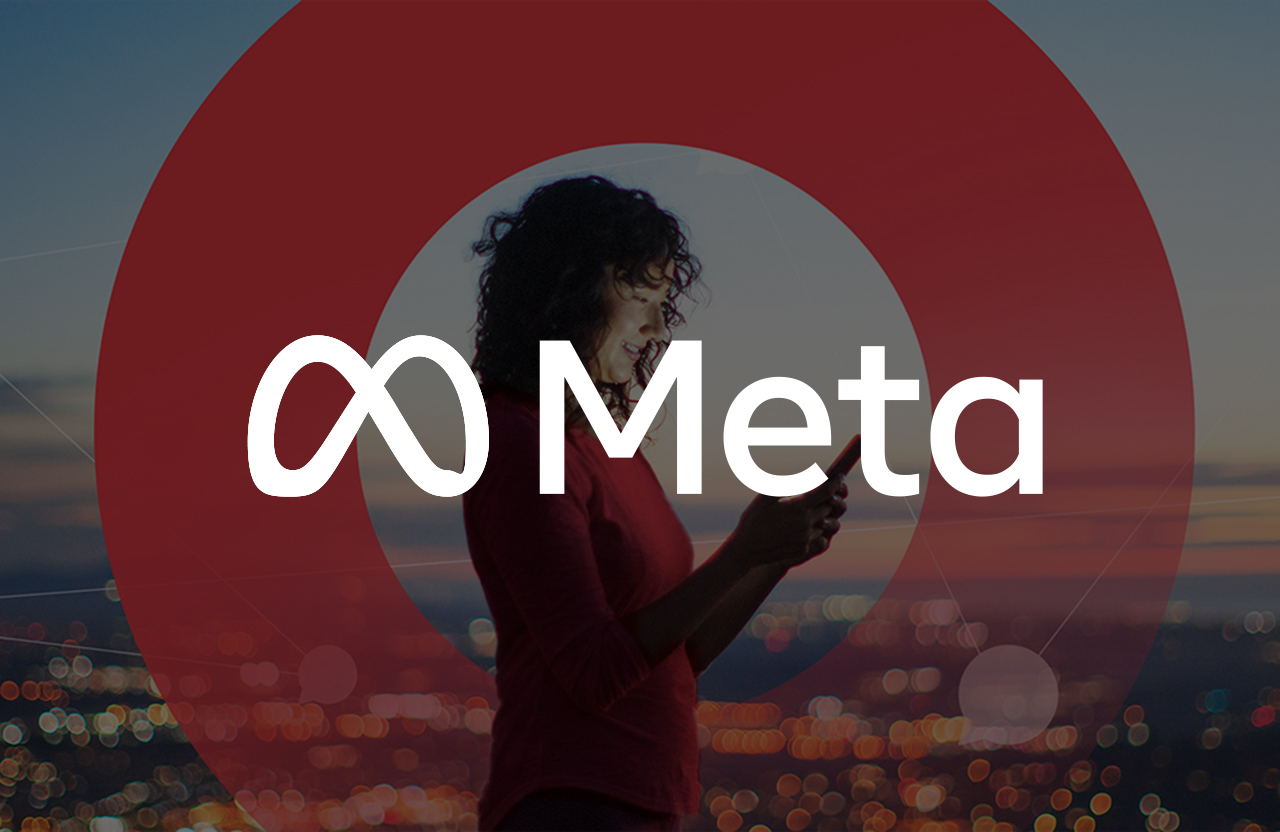 Woman looking her phone with a META logo overlay