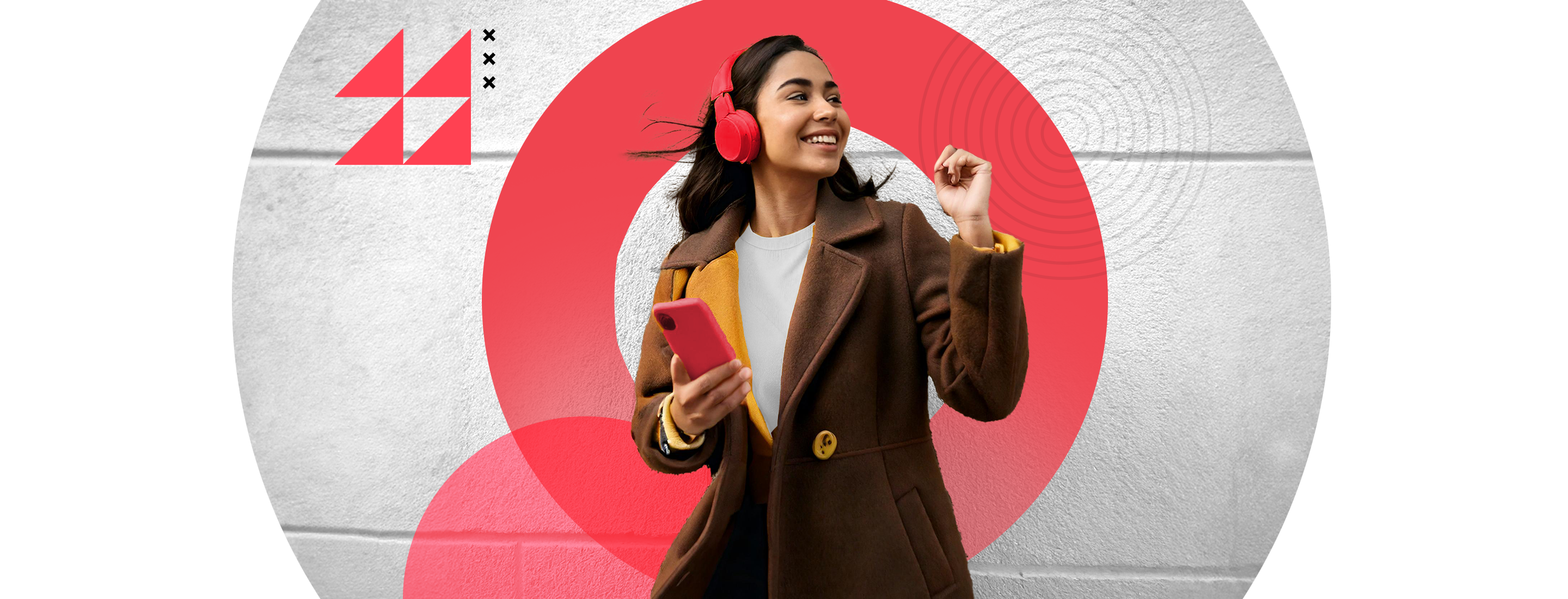 woman with smartphone and headphones smiling on street